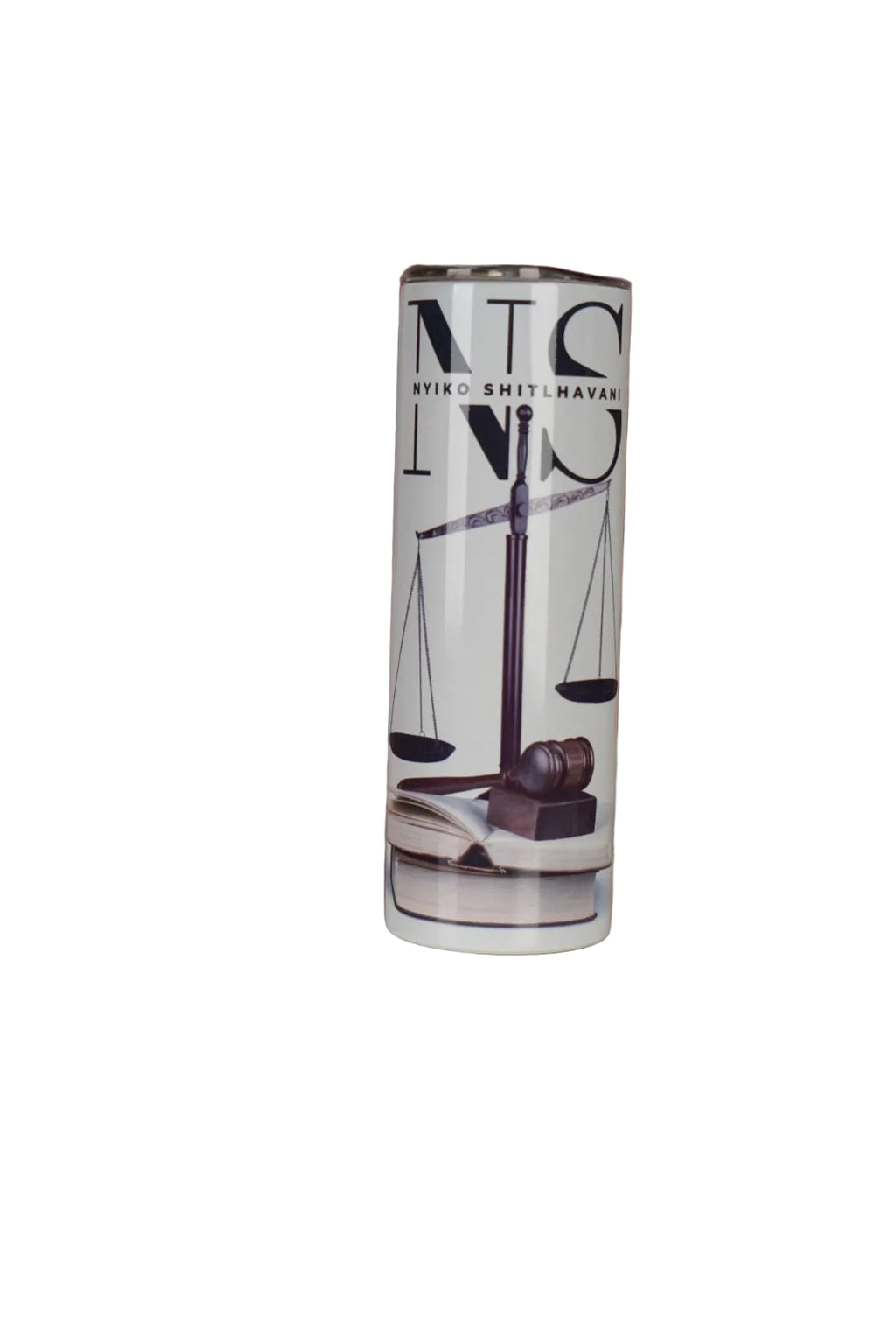 Tumbler with 'NS' branding on a surface with a decorative background