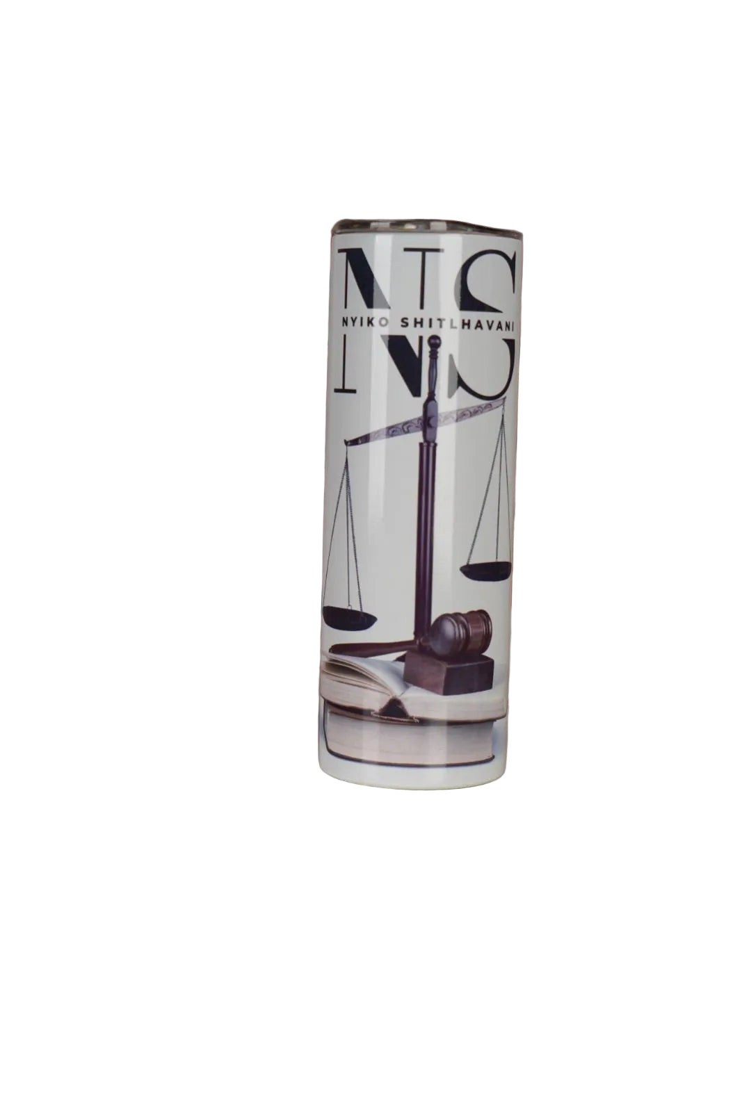 Tumbler with 'NS' branding on a surface with a decorative background