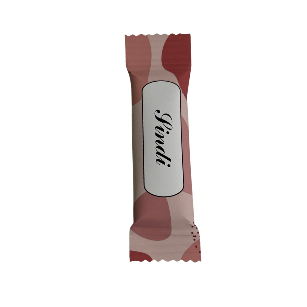 A single wrapped chocolate bar with a pink and red abstract pattern and a white label in the center with branded or personalised name in black script, isolated on a white background.