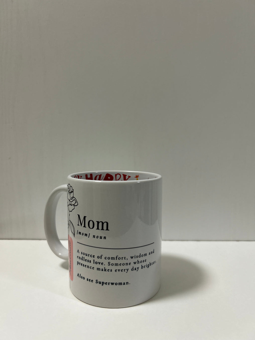 Personalised Mom Definition Mug with custom name and floral design, featuring a birthday surprise print inside. Close Up